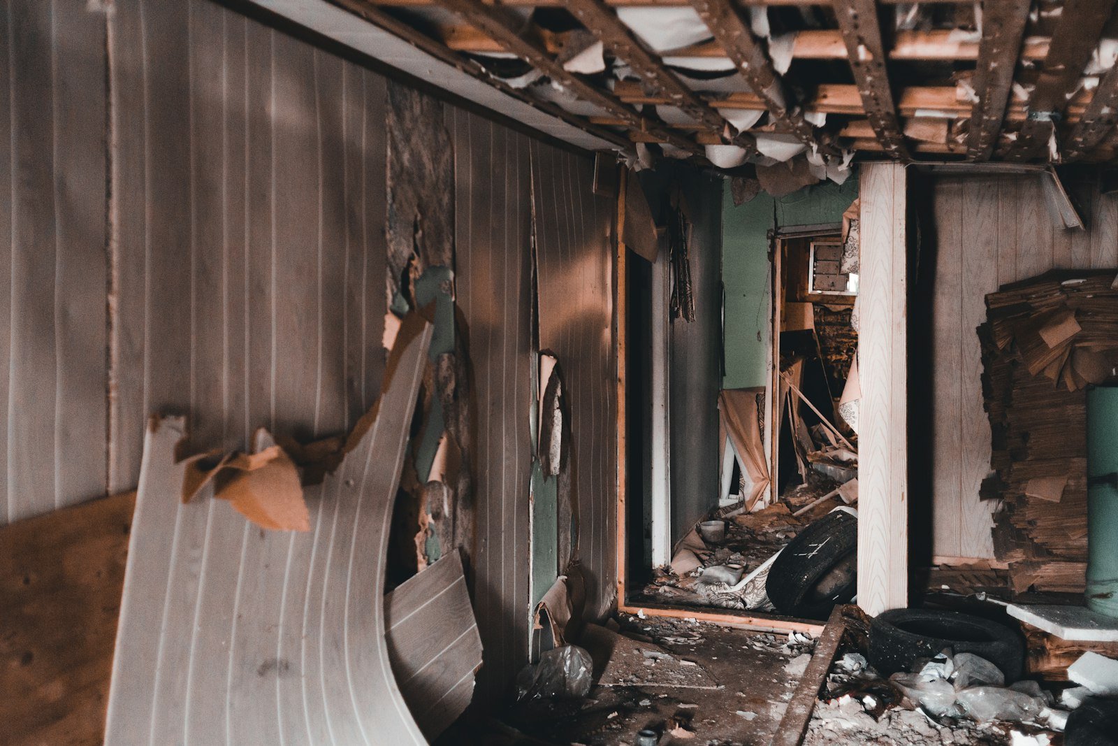 Interior room stripped back to bare studs so wet drywall and insulation can be replaced